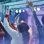 People partying and raising hands